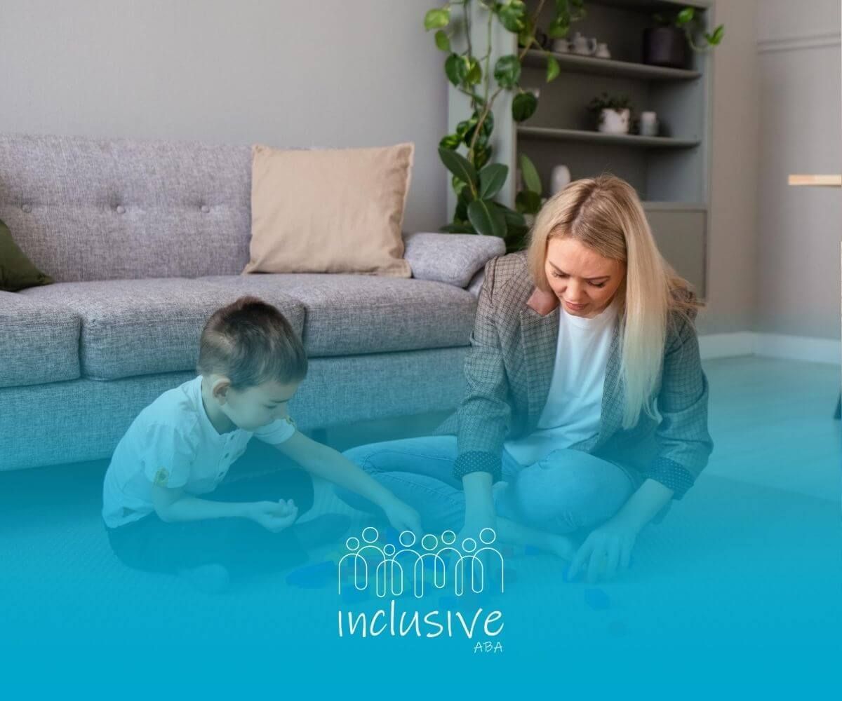 A BCBA and a child are playing with blocks on the floor during ABA therapy.