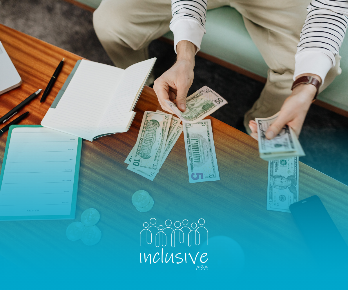 Person counting cash on a table with a notebook and pens, teal graphic below.