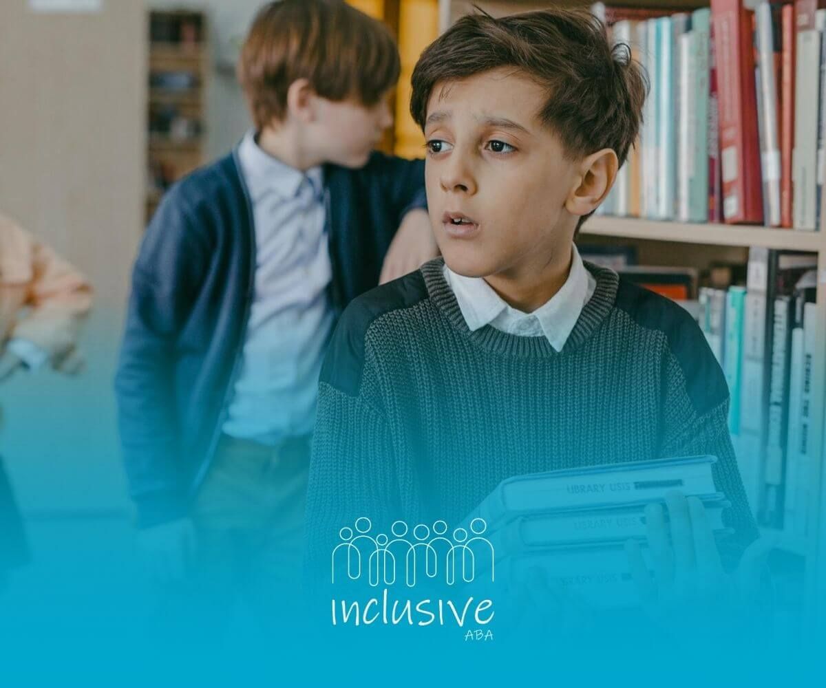 Autistic boy holds books in school library hallway, appearing concerned or deep in thought.