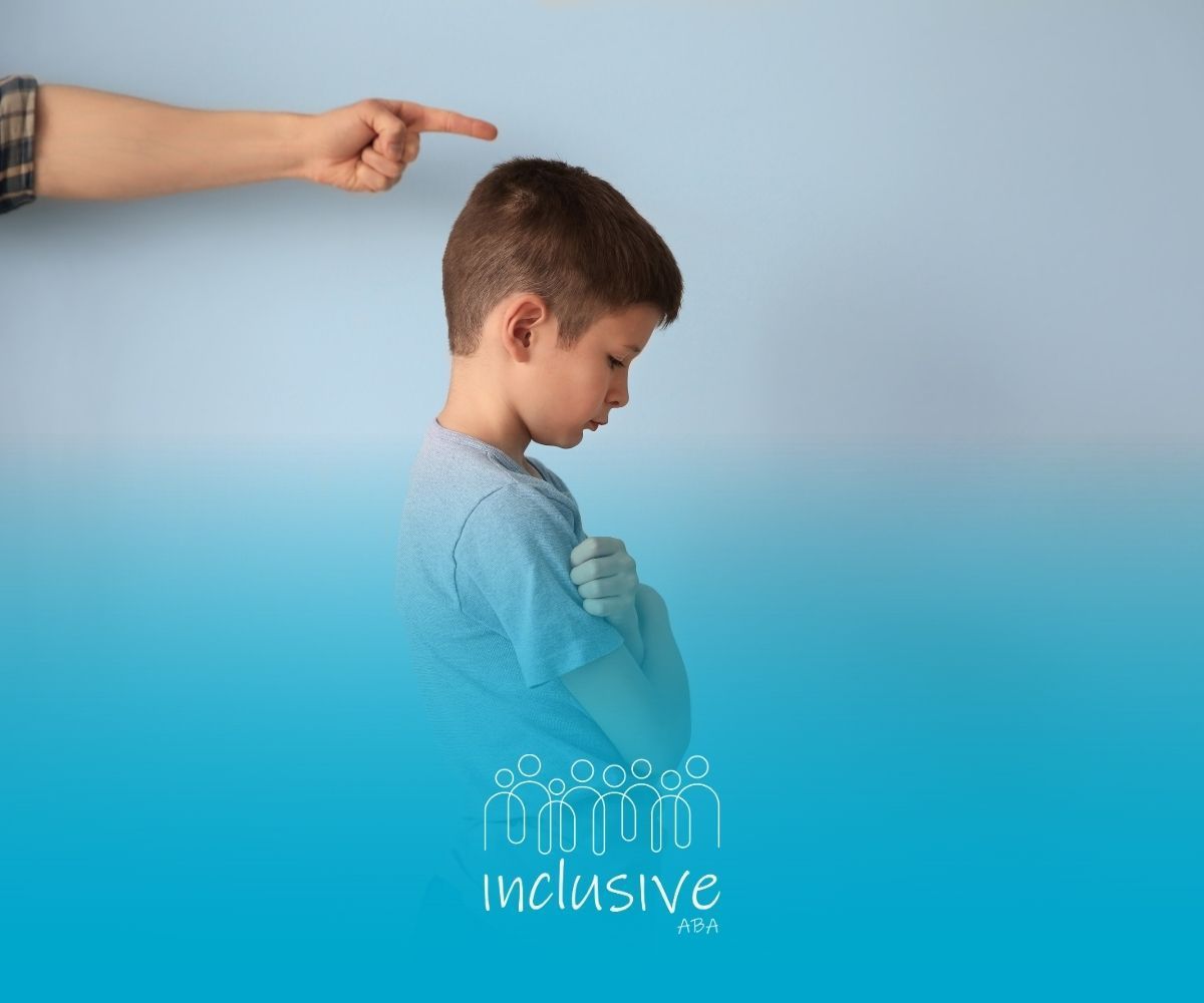 Person pointing at a sad child, blue background. Inclusive logo at the bottom.
