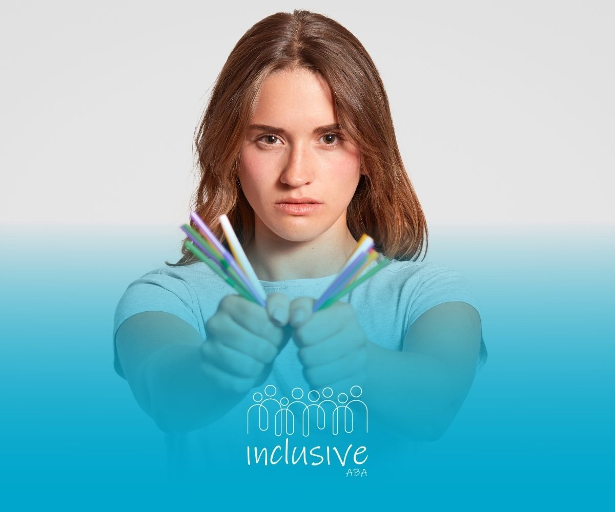 Woman holding pens in an X shape, blue shirt, angry expression, against a gradient blue and white background.
