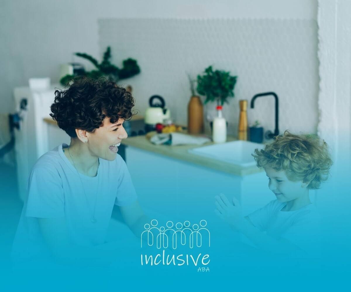 ABA therapist & autistic child playing together in the kitchen, smiling and laughing after therapy.
