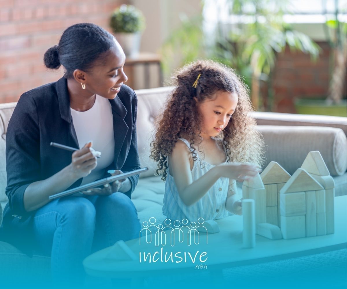 A woman is sitting on a couch with a little girl playing with wooden blocks.