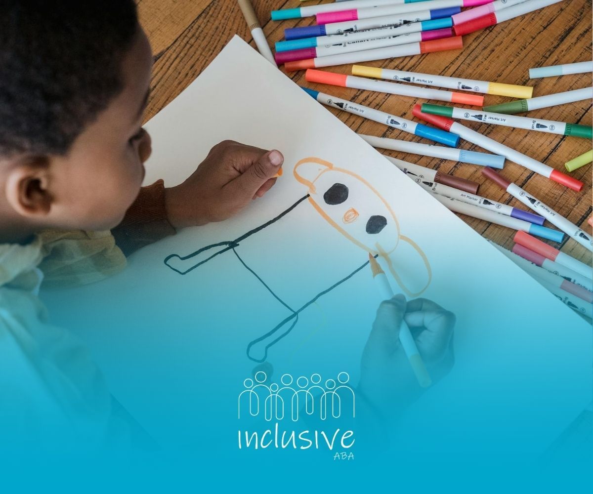 An autistic child drawing with markers on a paper surrounded by crayons during ABA therapy in NV.