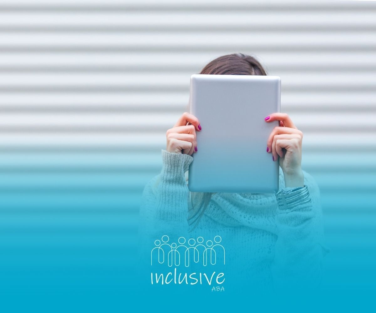 Person holding a tablet in front of their face. White and blue background. Inclusive logo.
