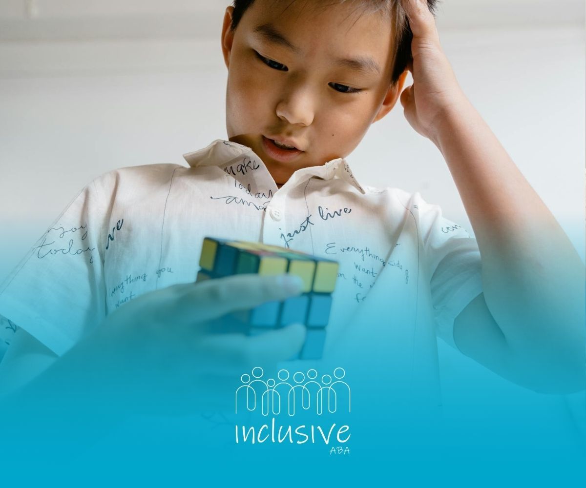 Autistic boy stressing out while solving a Rubik's cube, holding his head with one hand in Colorado.