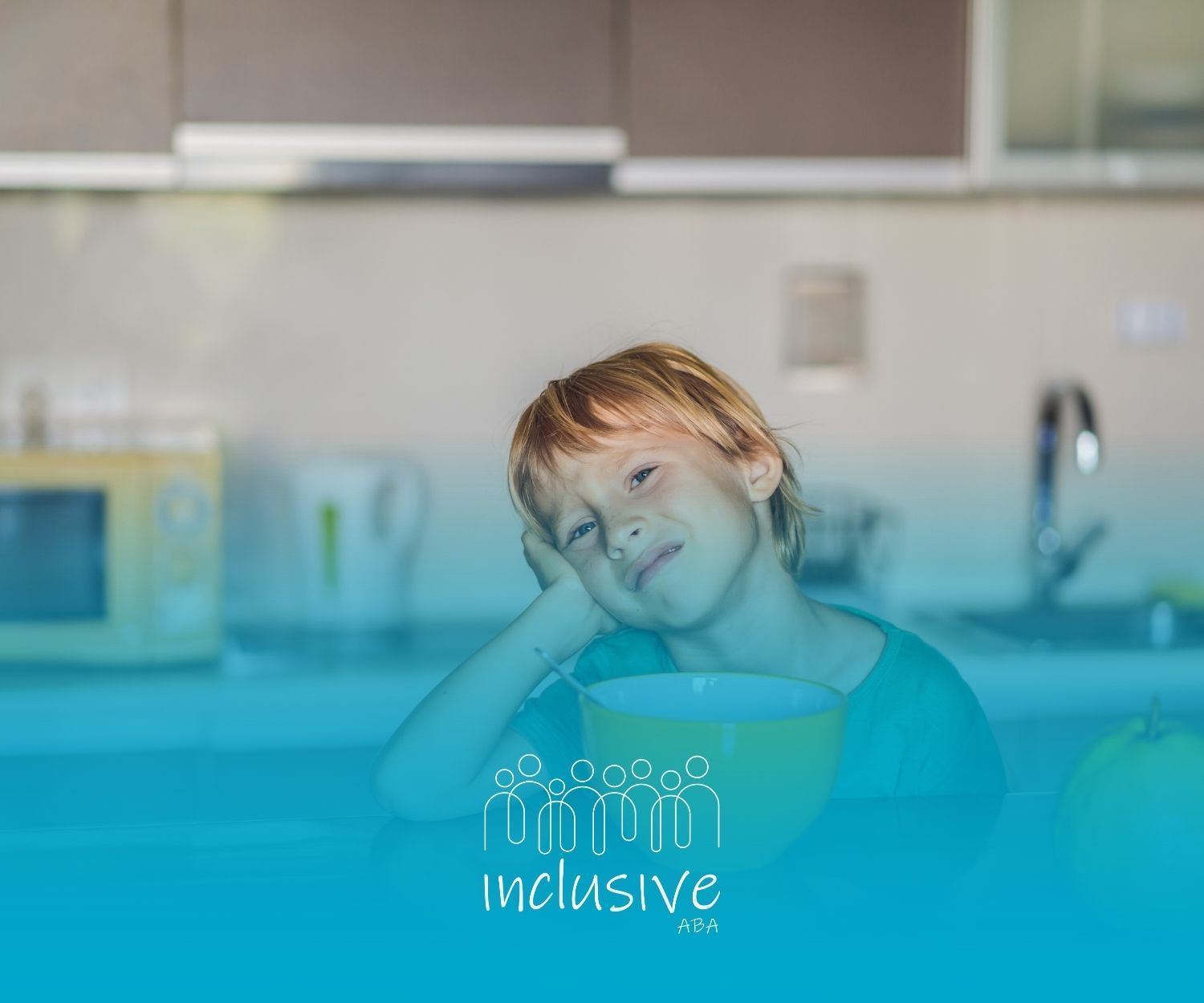 Child at kitchen table, resting head on hand, looking at a bowl. 