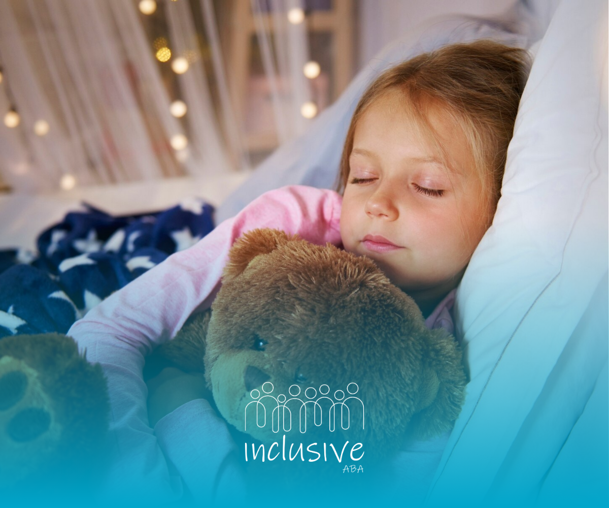 A little girl is sleeping in a bed with a teddy bear.