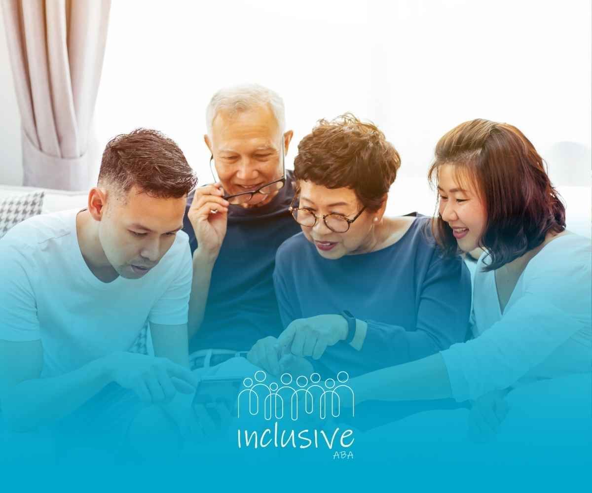 Family gathered on couch looking at a phone, pointing and smiling.