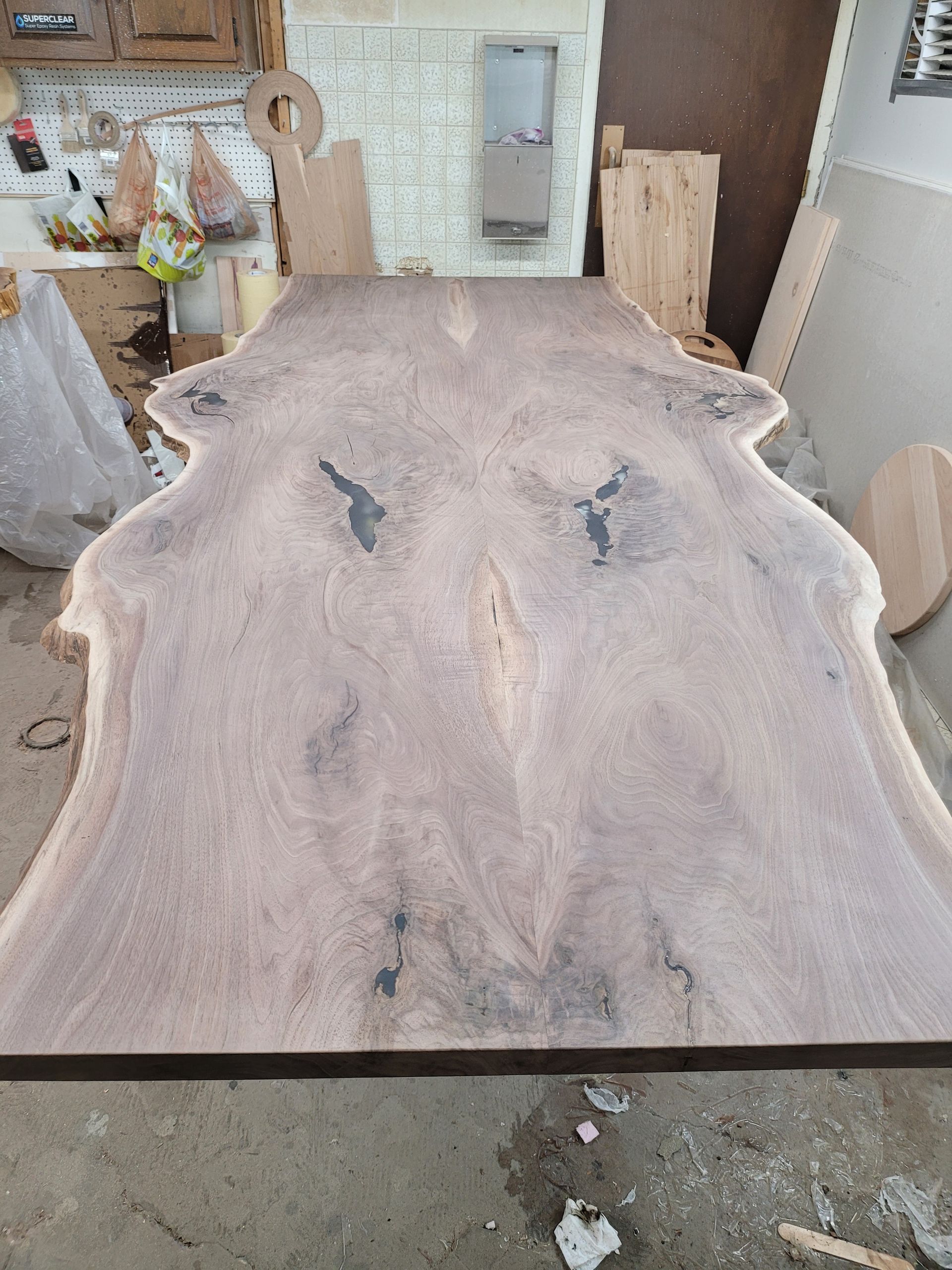 A large piece of wood is sitting on top of a table in a room.