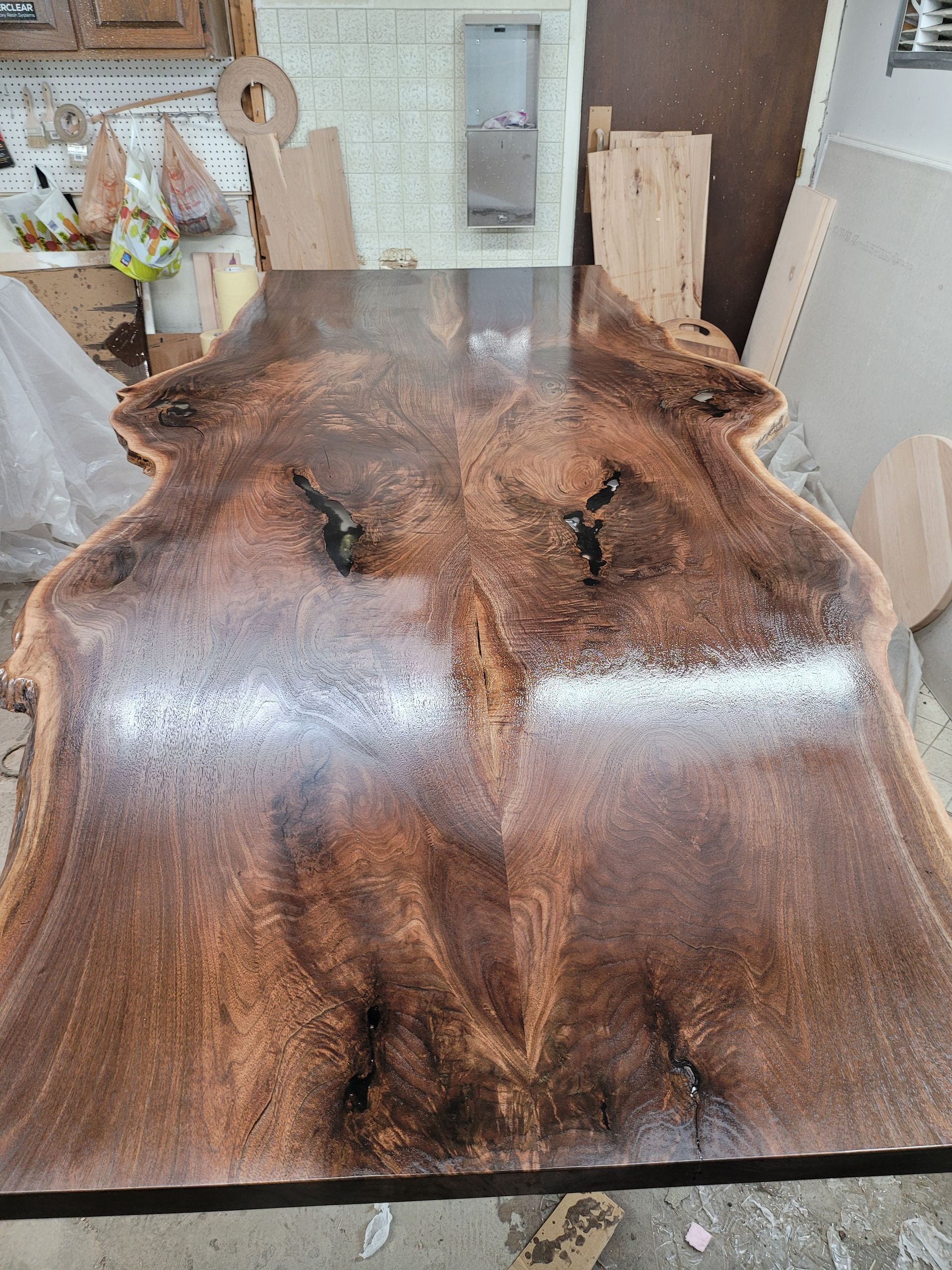 A large piece of wood is sitting on top of a table in a room.