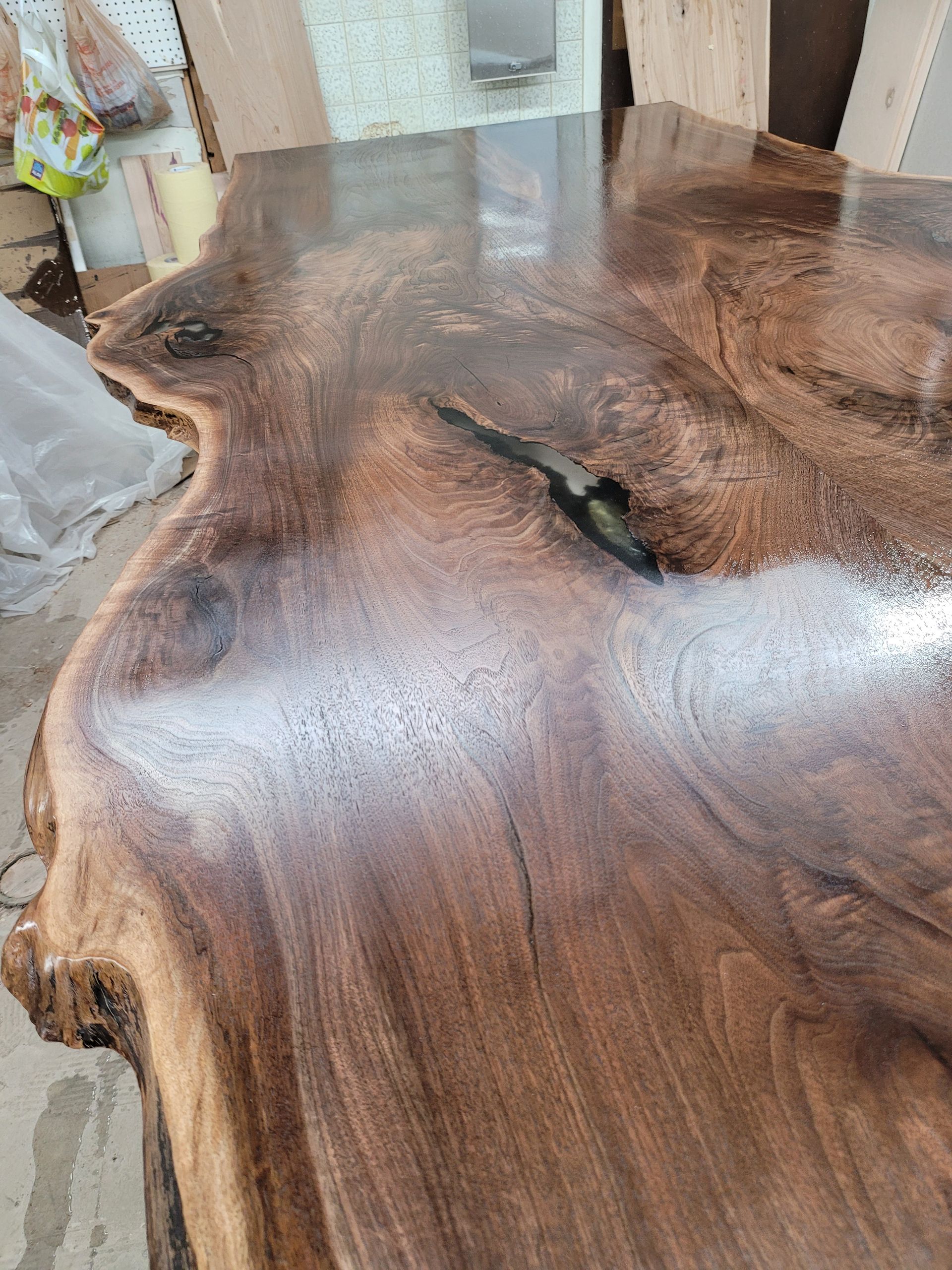 A close up of a wooden table with a shiny finish.
