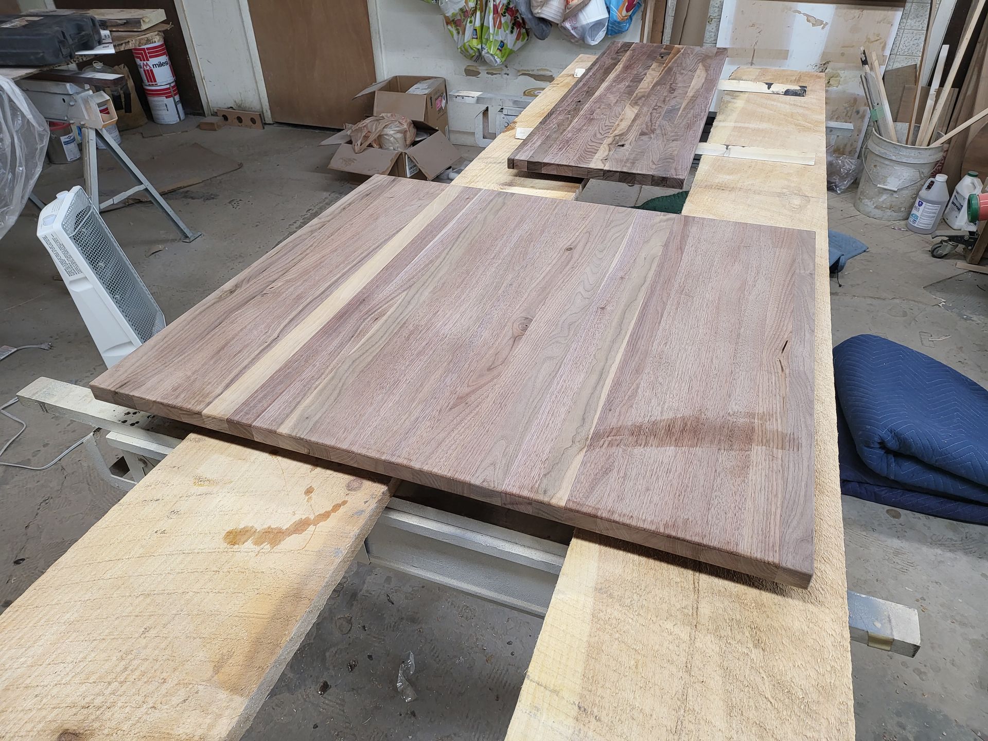 Two pieces of wood are sitting on top of each other on a table.