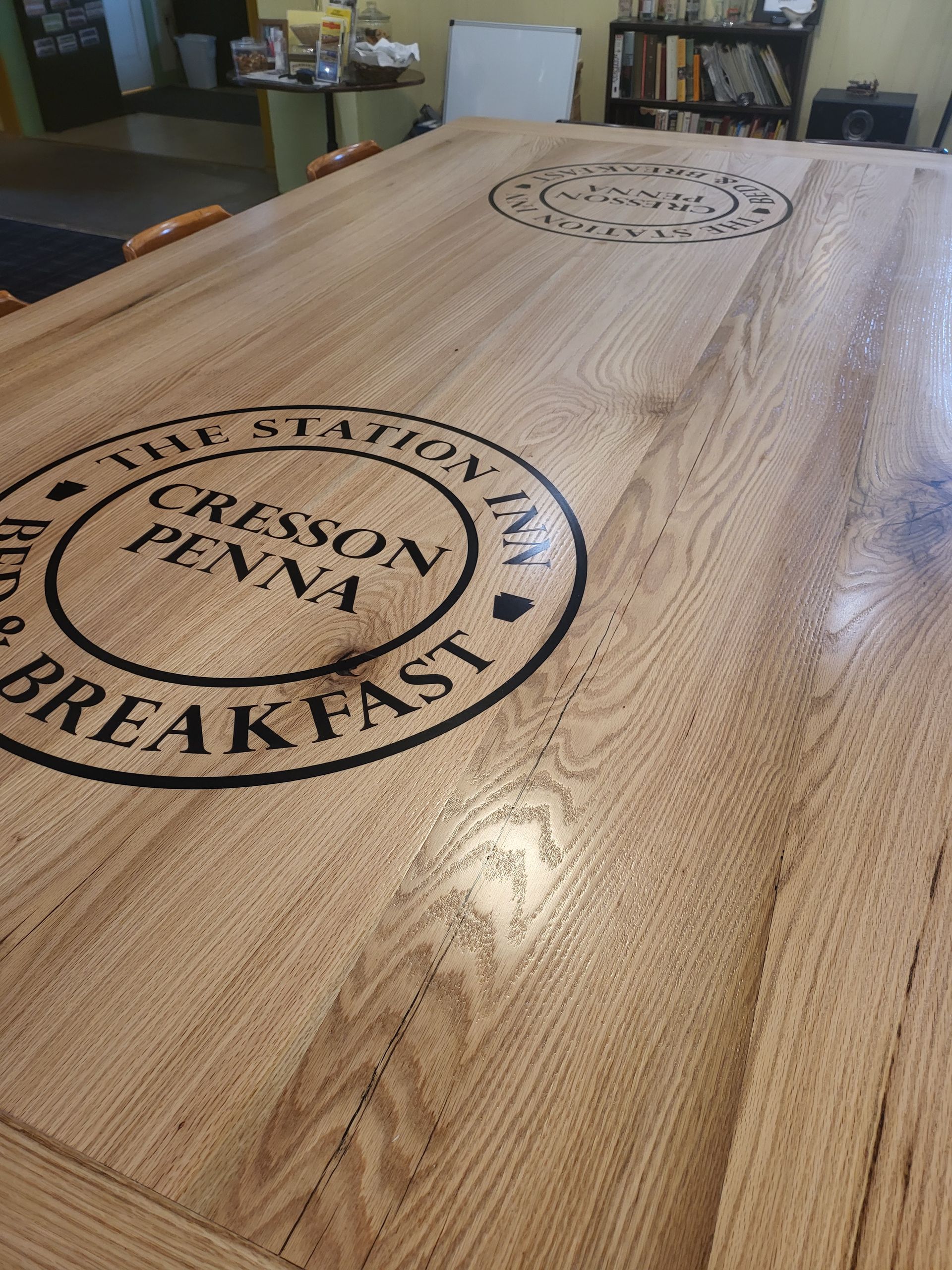 A wooden table with the words cresson penna breakfast written on it