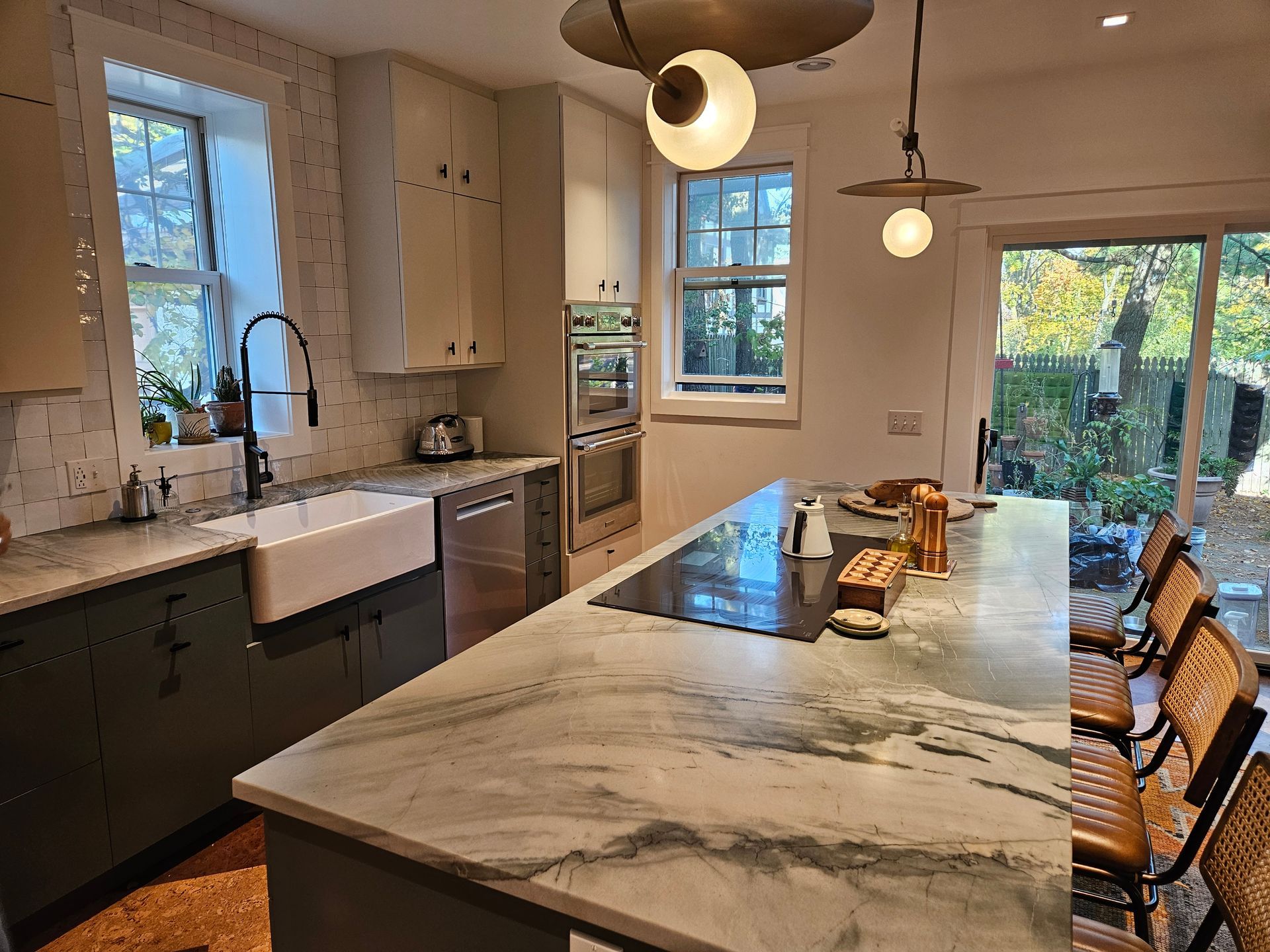 There is a large island in the middle of the kitchen.