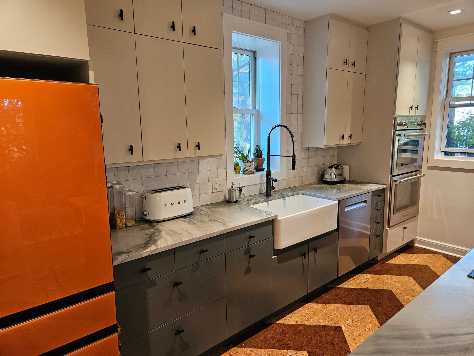 A kitchen with stainless steel appliances and a sink