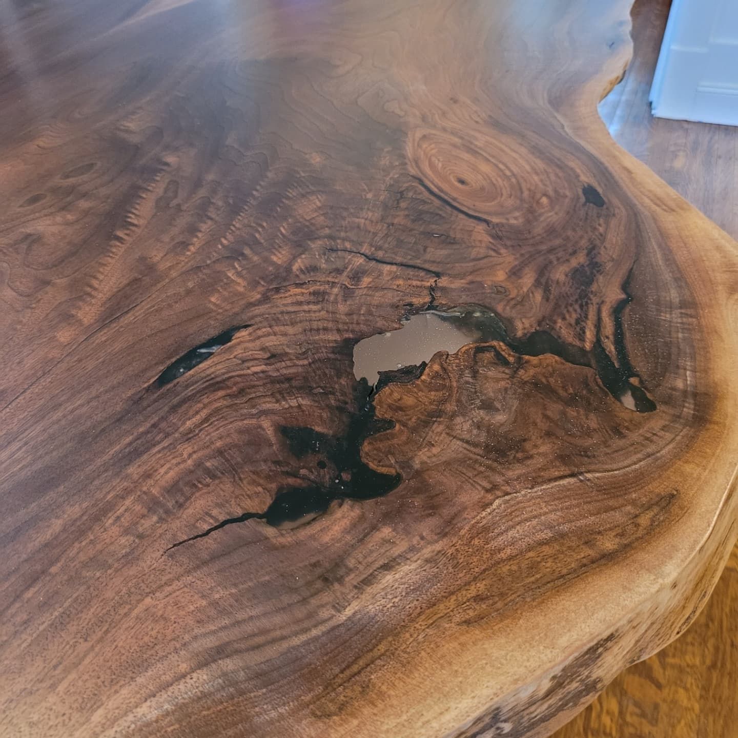 A close up of a piece of wood with a hole in it.