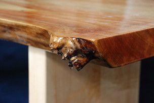 A close up of a piece of wood on a table.