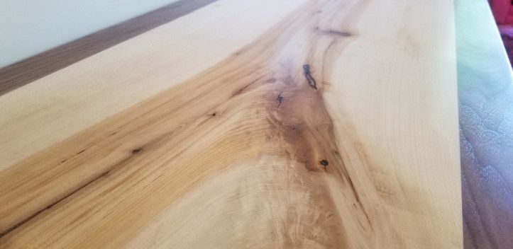 A close up of a piece of wood on a table.