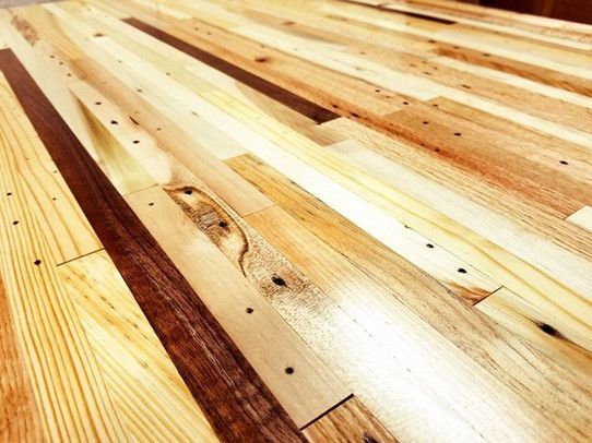 A close up of a wooden table with a lot of pieces of wood