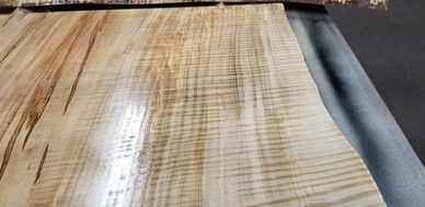 A close up of a piece of wood on a table.