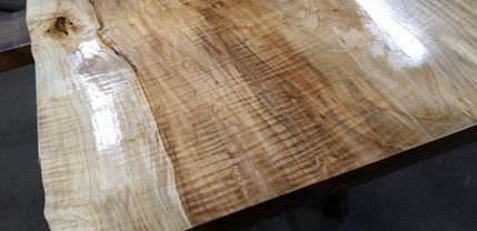 A close up of a piece of wood sitting on top of a table.