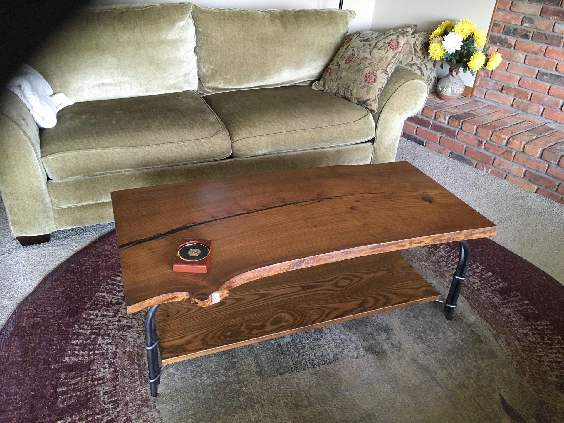 A living room with a couch and a coffee table