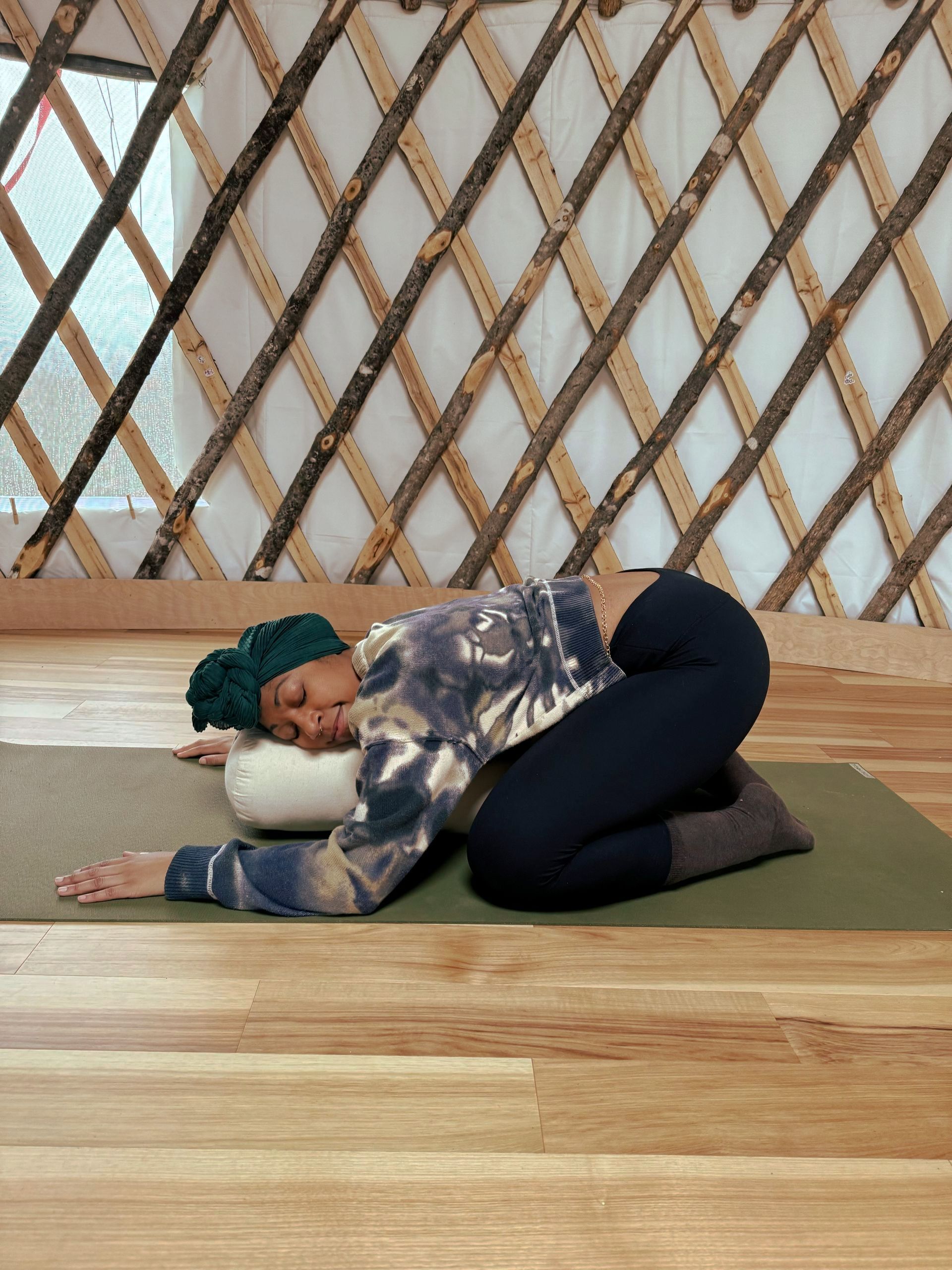 Patrice in supported child's pose