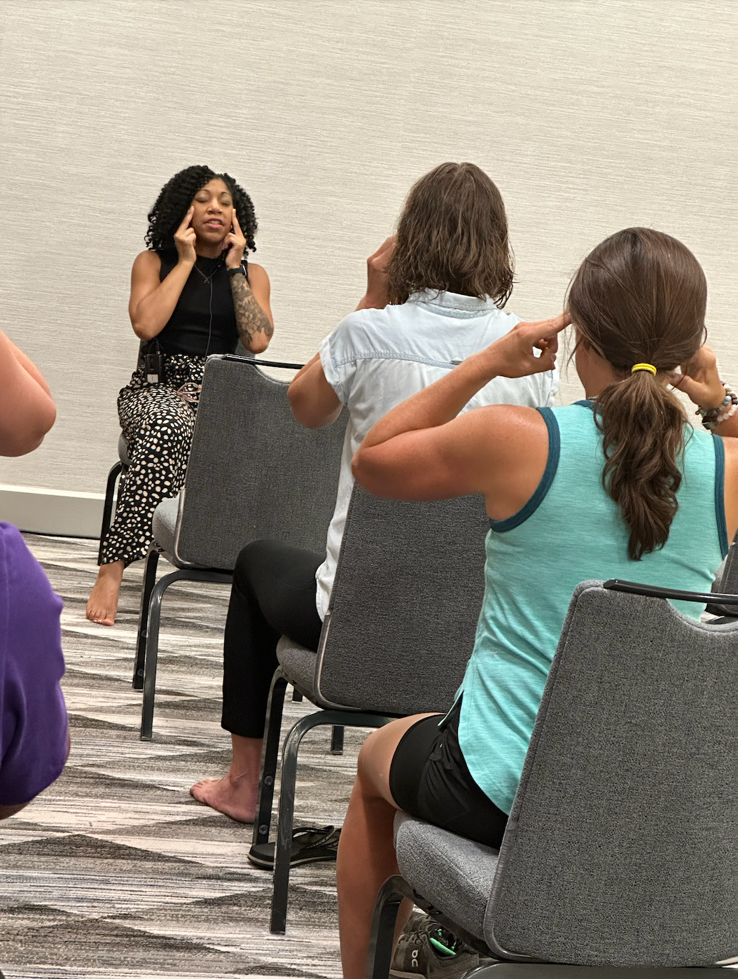 Patrice in a seated twist at Fireside Yoga