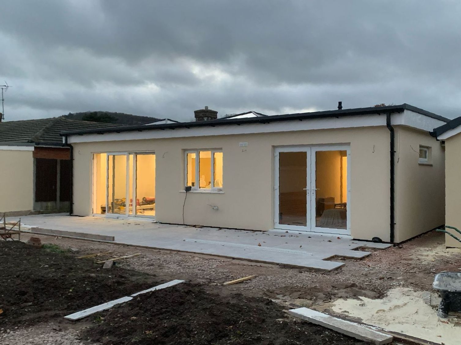 A house that is being built with a lot of windows and doors