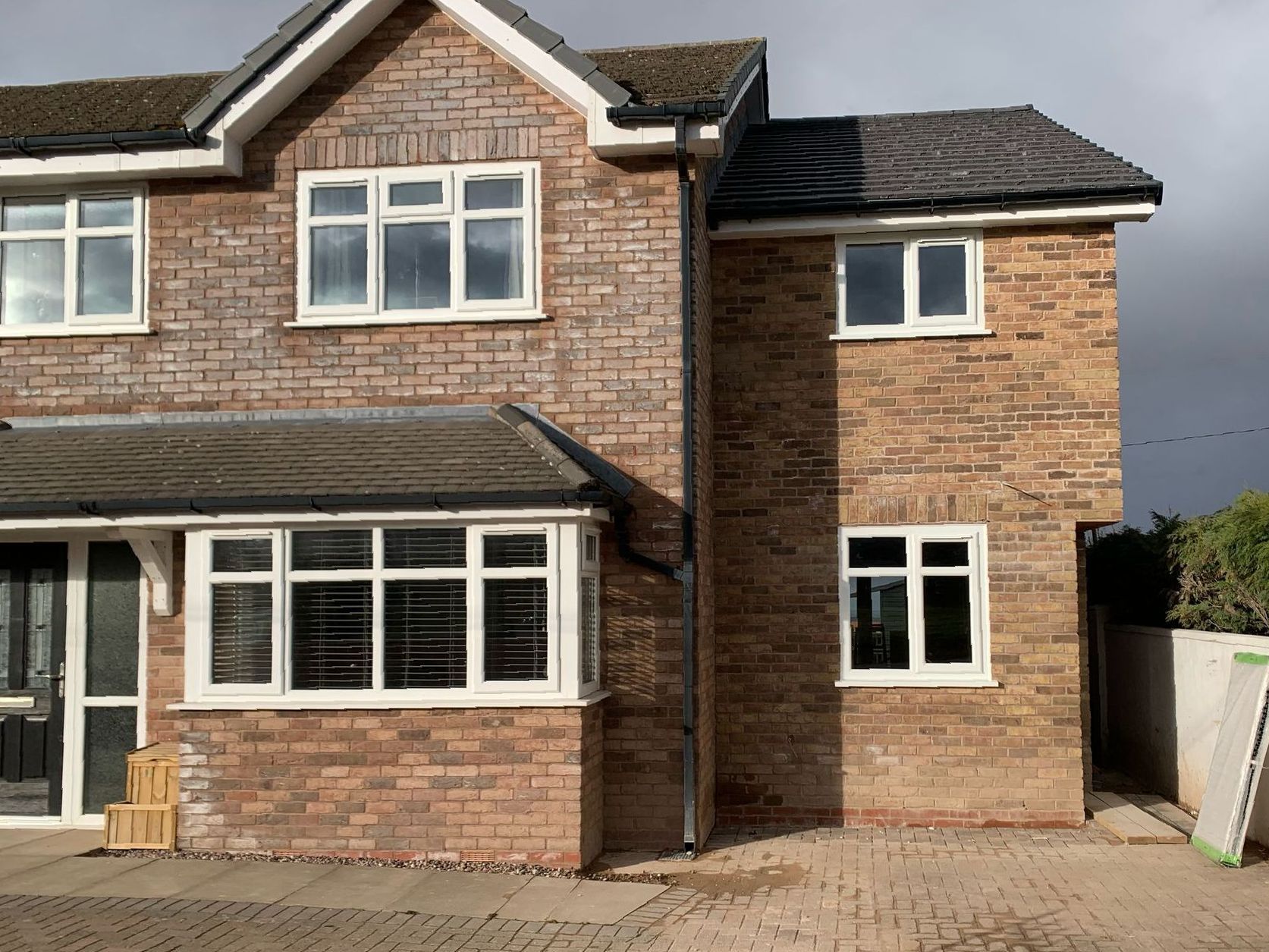 A large brick house with a lot of windows