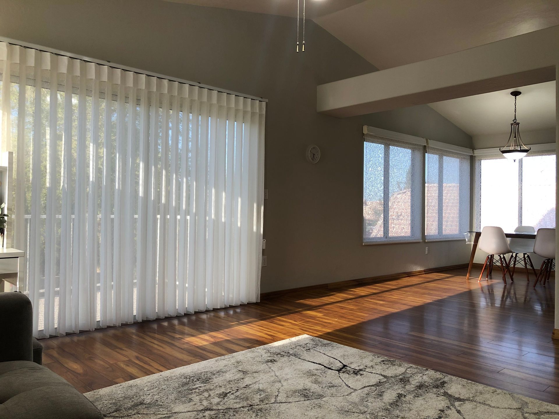 Vertical blinds cover large outdoor facing windows