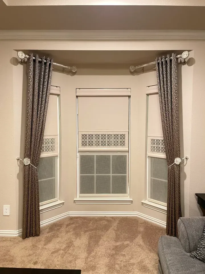 laser cut shades with curtains that are drawn back