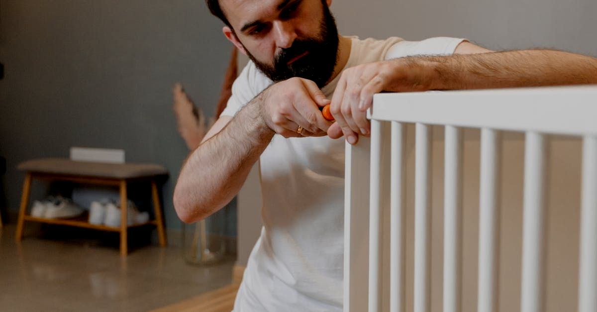 A man preparing blinds before installing them