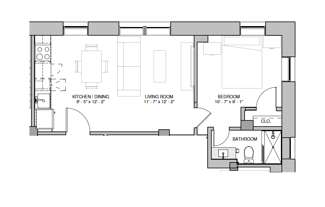 Floor plan of an apartment with kitchen/dining, living room, bedroom, and bathroom.