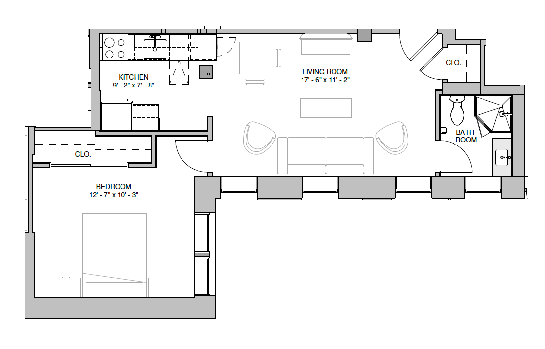 Floor plan of an apartment with kitchen/dining, living room, bedroom, and bathroom.