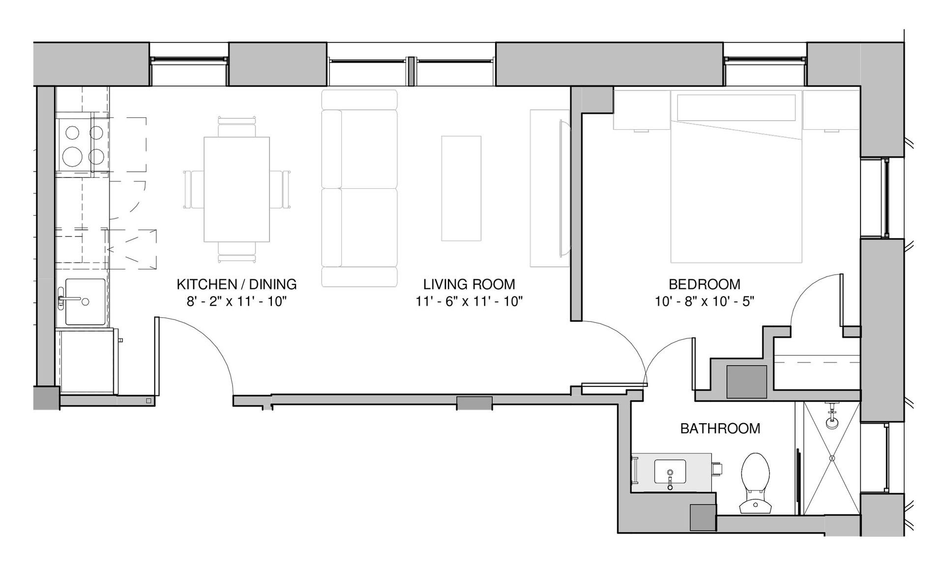 Floor plan of an apartment with kitchen/dining, living room, bedroom, and bathroom.
