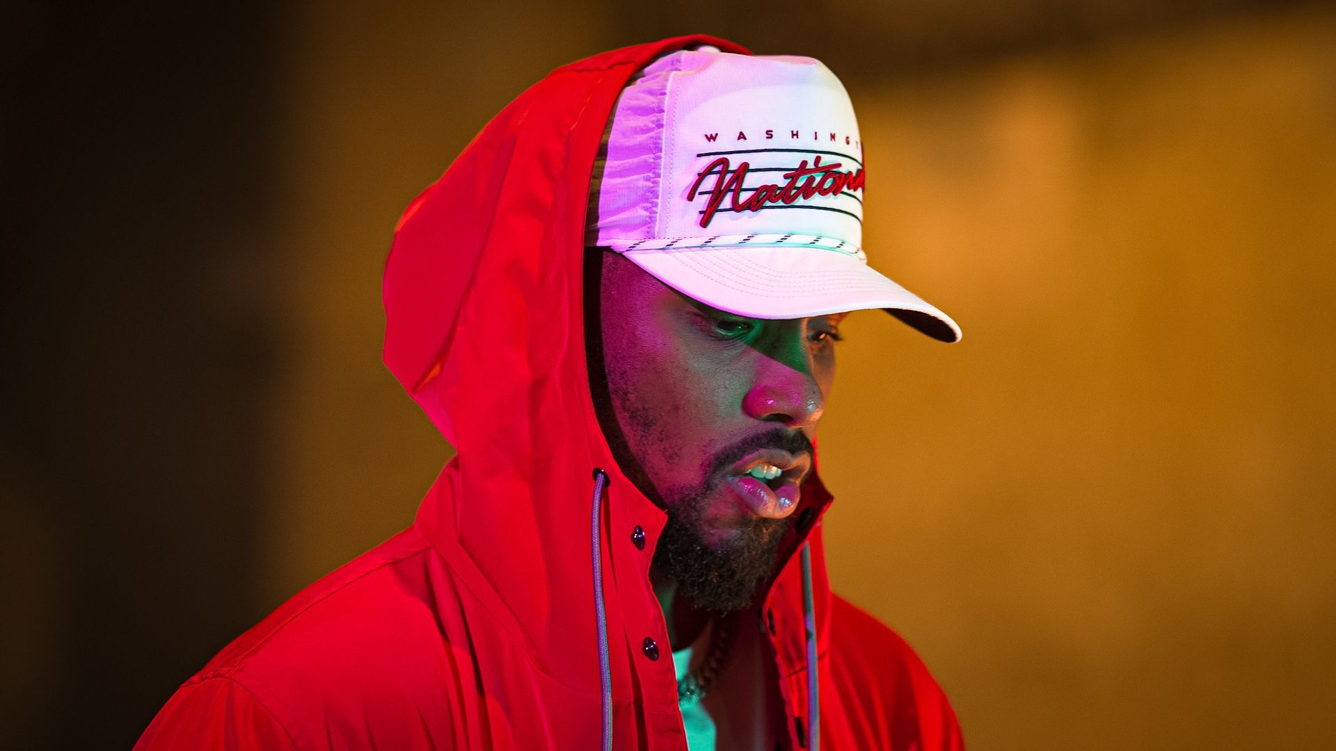 S1K Prince with a cap and red hoodie.