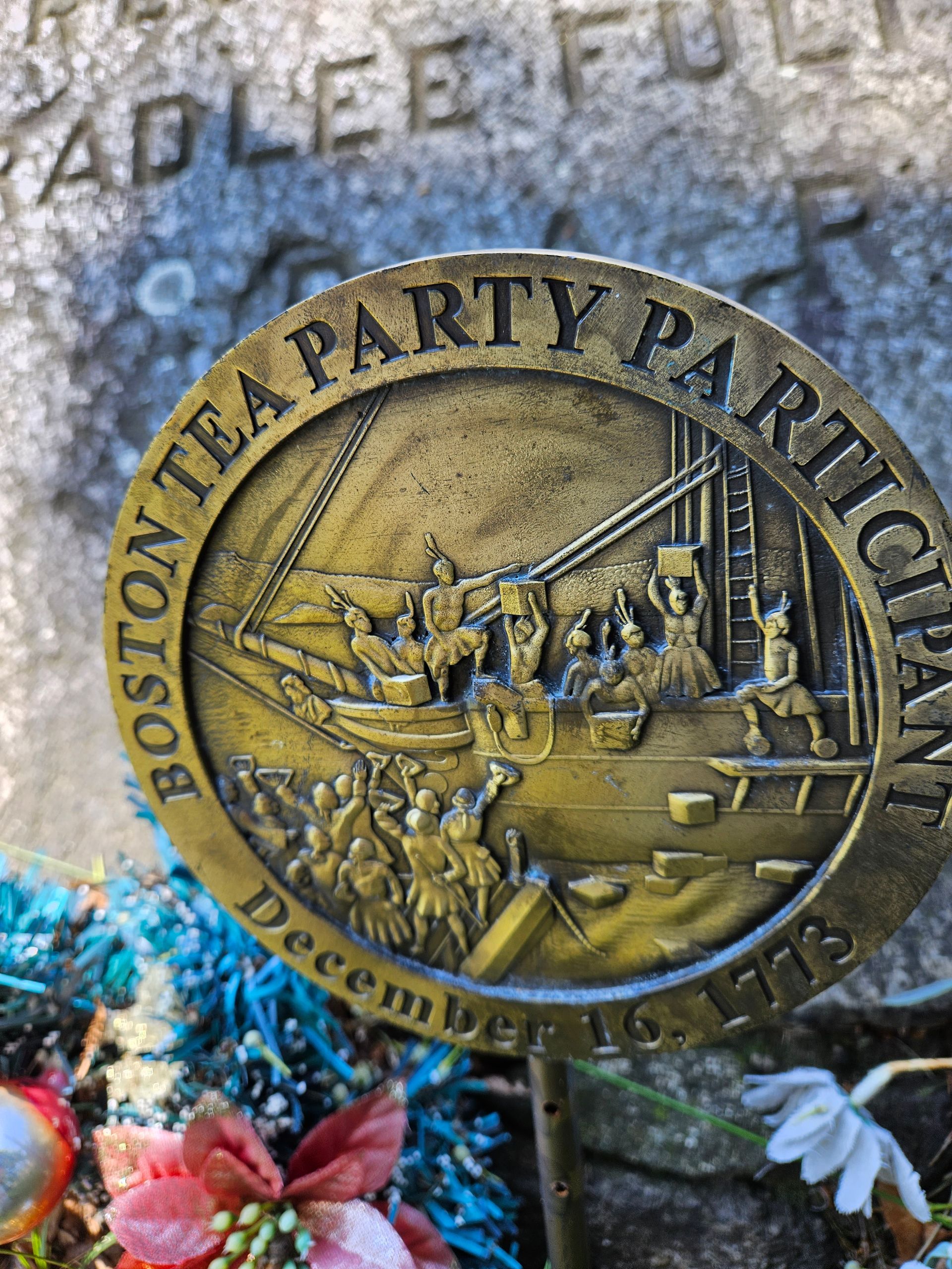 A coin that says boston tea party participant on it