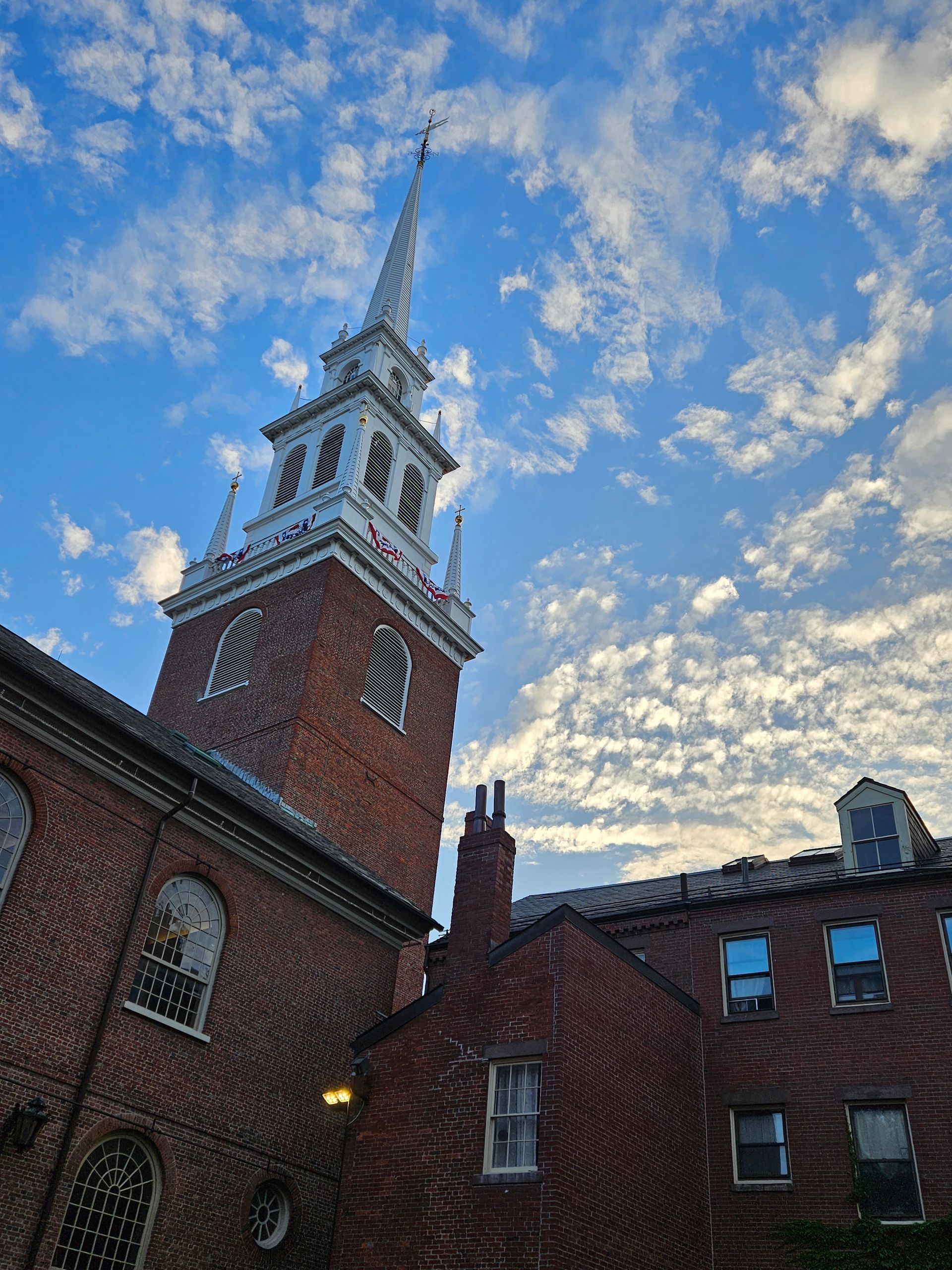 A large brick building with a clock tower on top of it.
