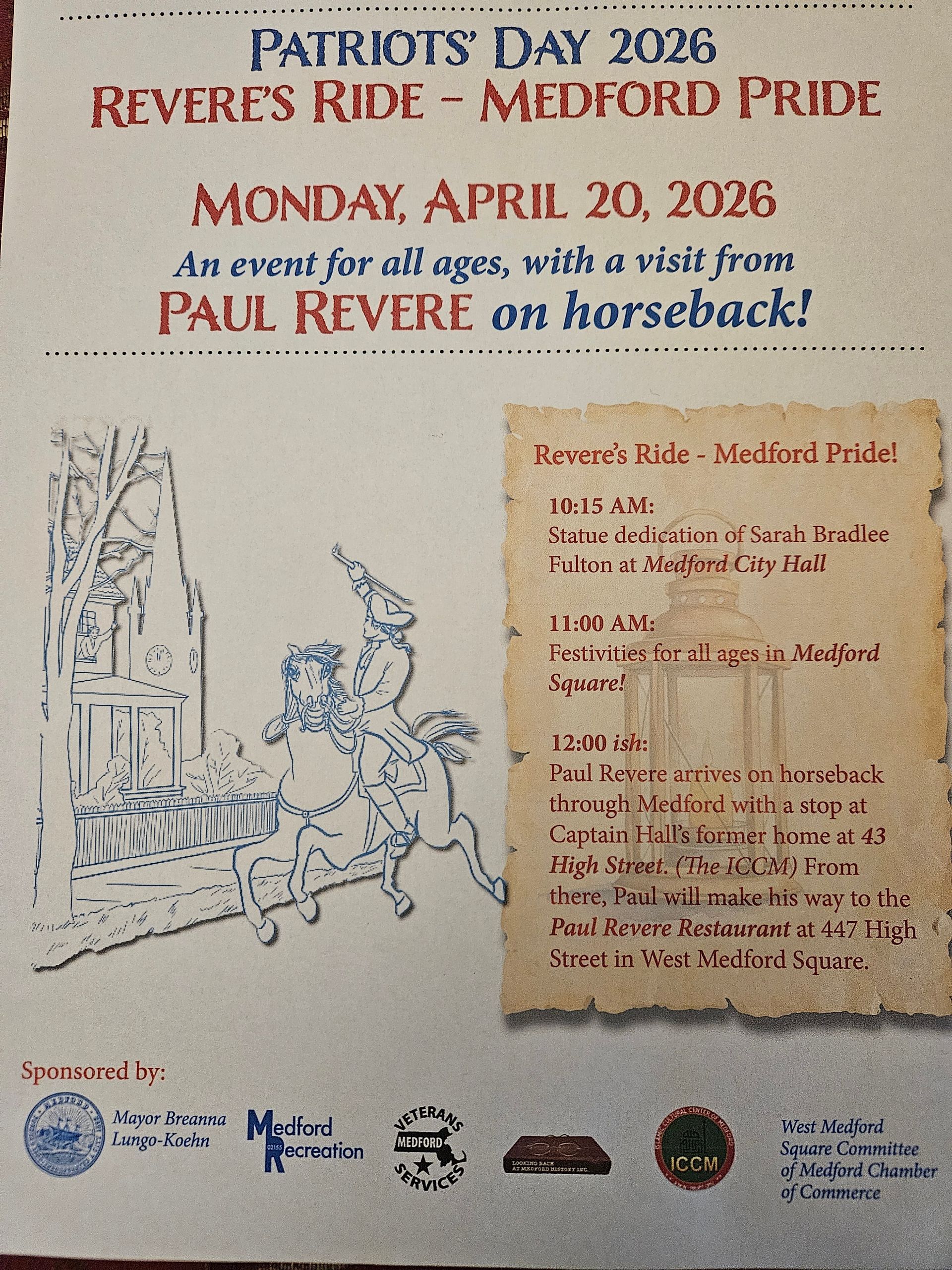 A man and a woman are posing for a picture in front of a statue.