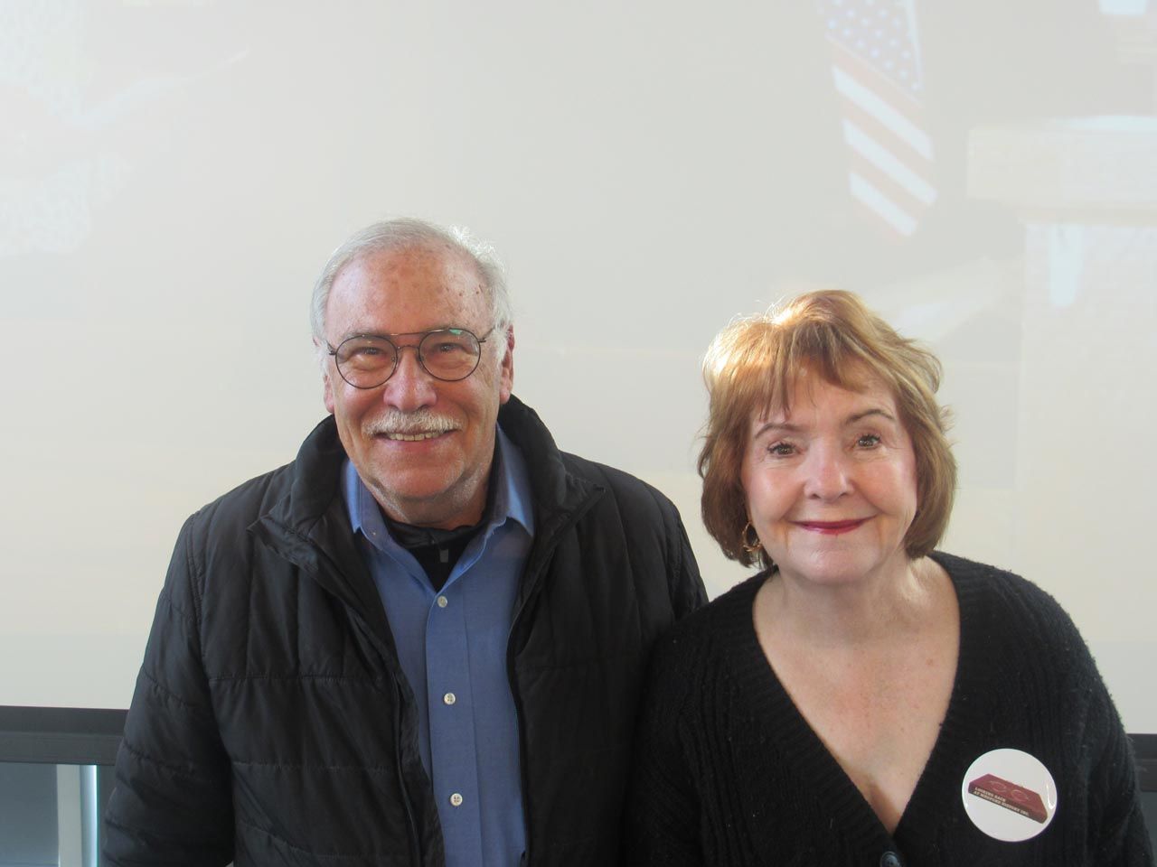 A man and a woman are posing for a picture together