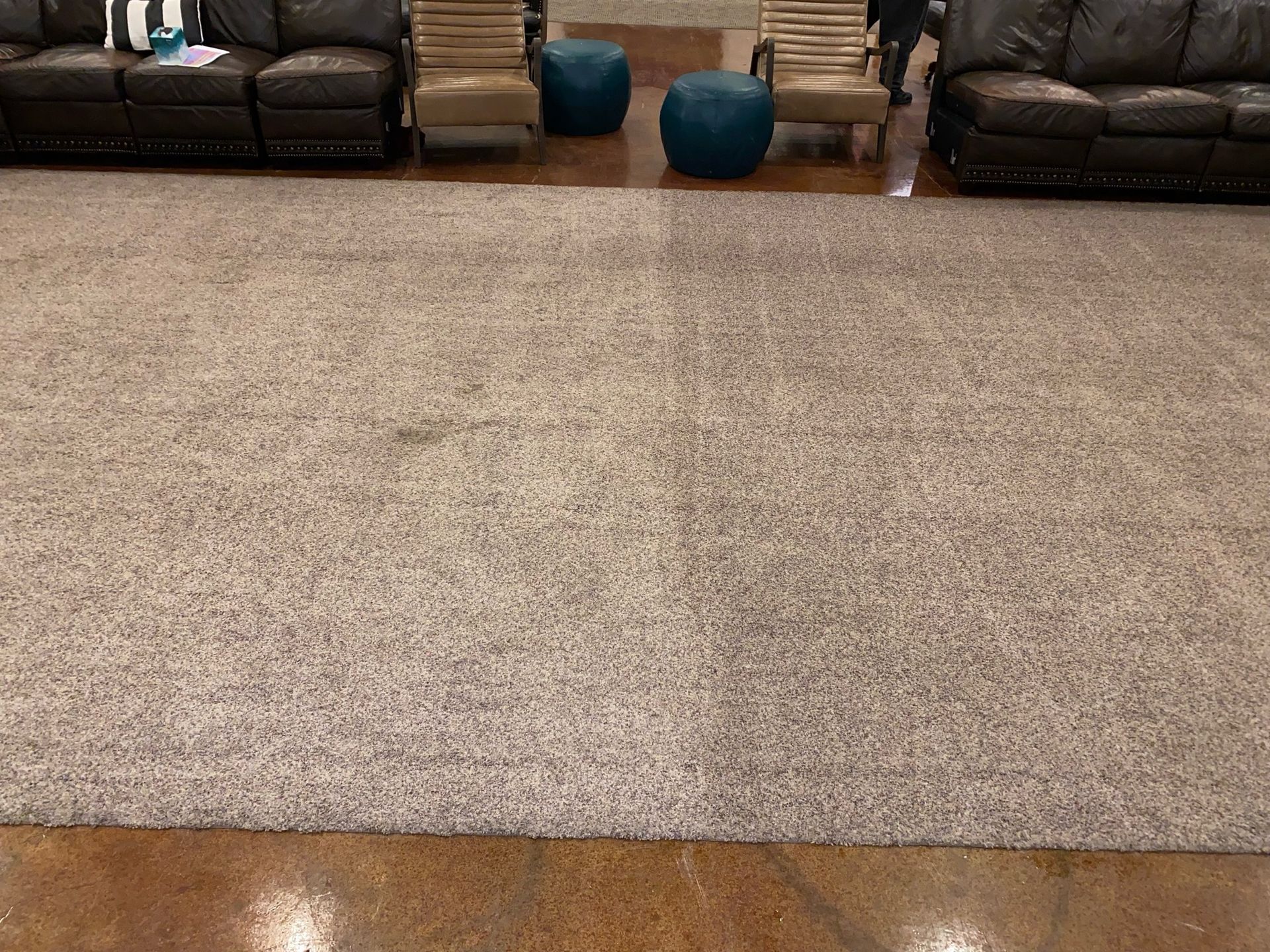 There is a large rug in the middle of the room.