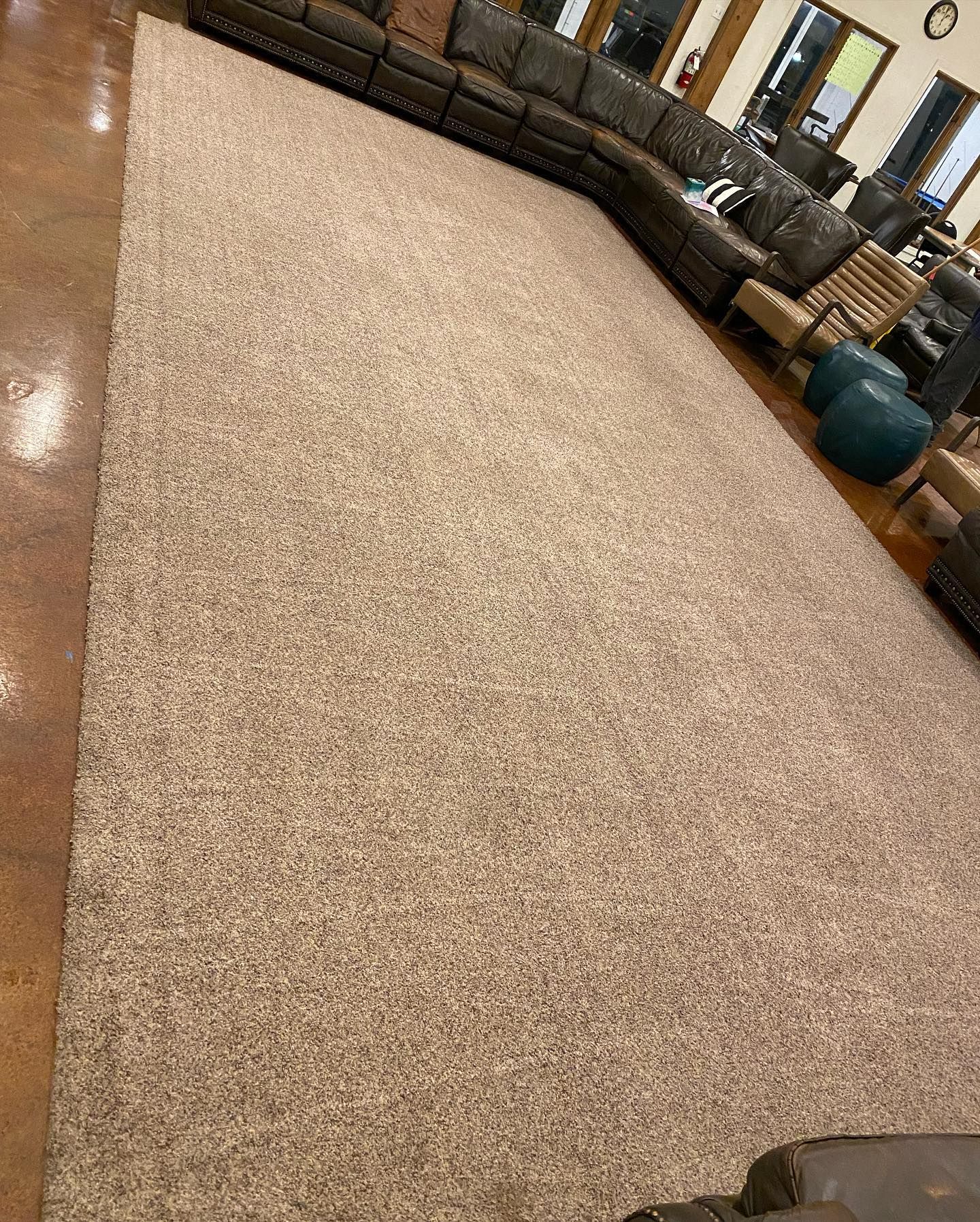 There is a large rug in the middle of the room.