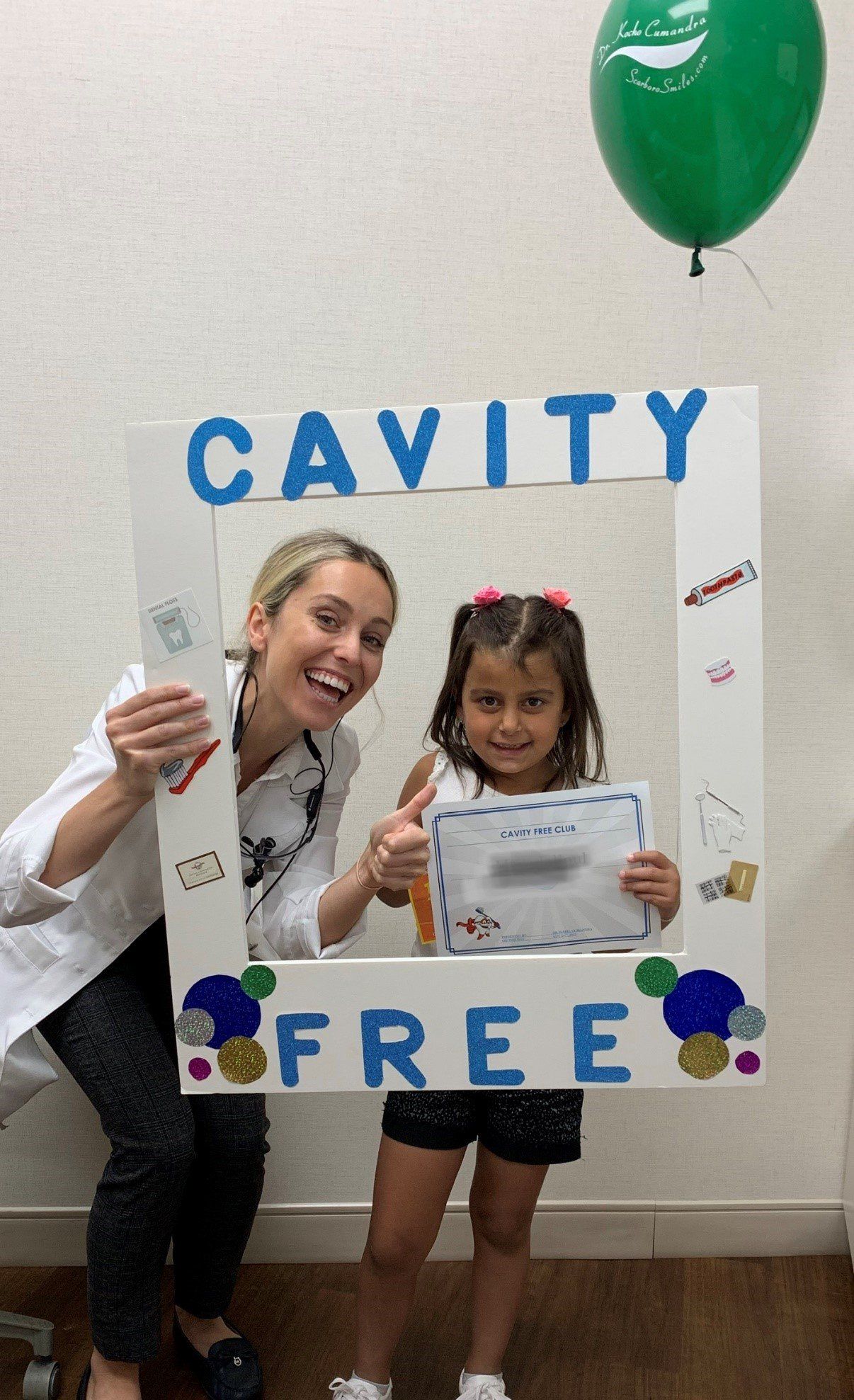 Cavity Free Club | Dr. Isabel Cumandra Smiling With A Child | Pediatric Dentistry | Family Dentistry | ScarboroSmiles | Best Dentist in Scarborough
