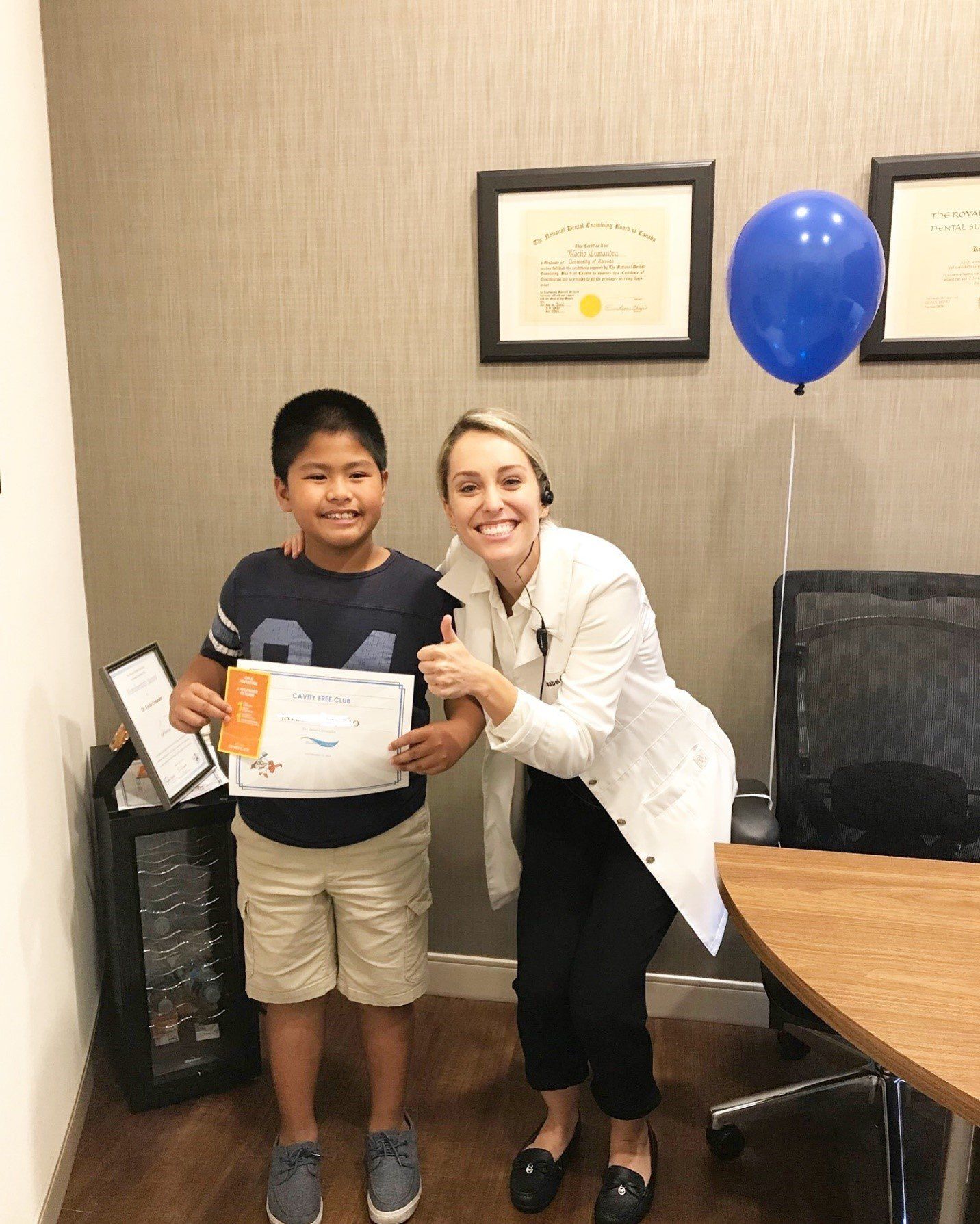 Cavity Free Club | Dr. Isabel Cumandra Smiling With A Child | Pediatric Dentistry | Family Dentistry | ScarboroSmiles | Best Dentist in Scarborough