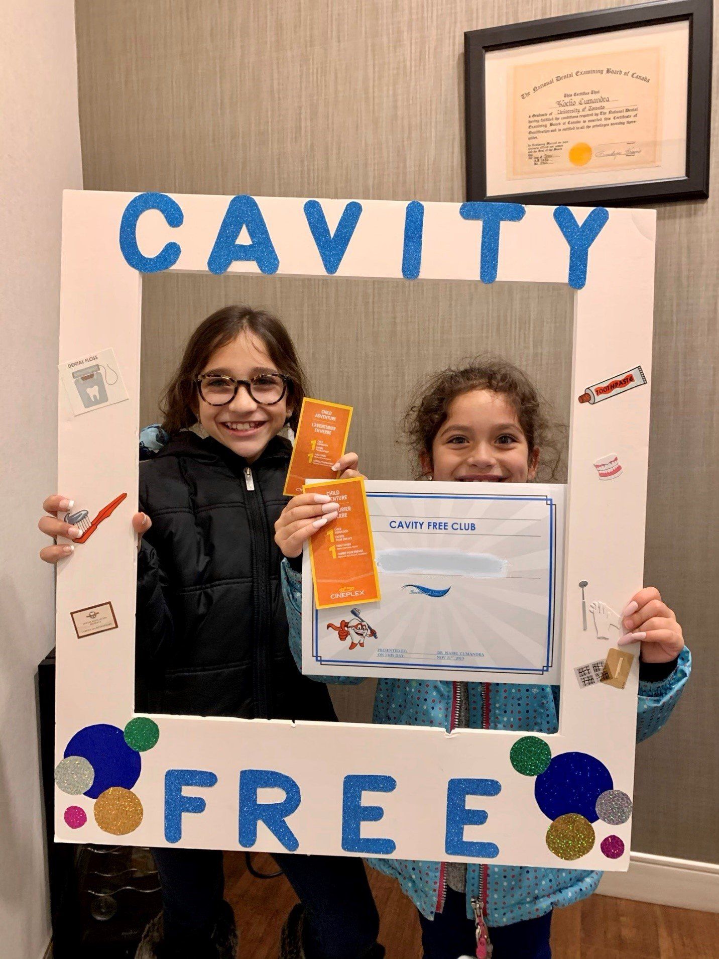 Cavity Free Club | Dr. Isabel Cumandra Smiling With A Child | Pediatric Dentistry | Family Dentistry | ScarboroSmiles | Best Dentist in Scarborough