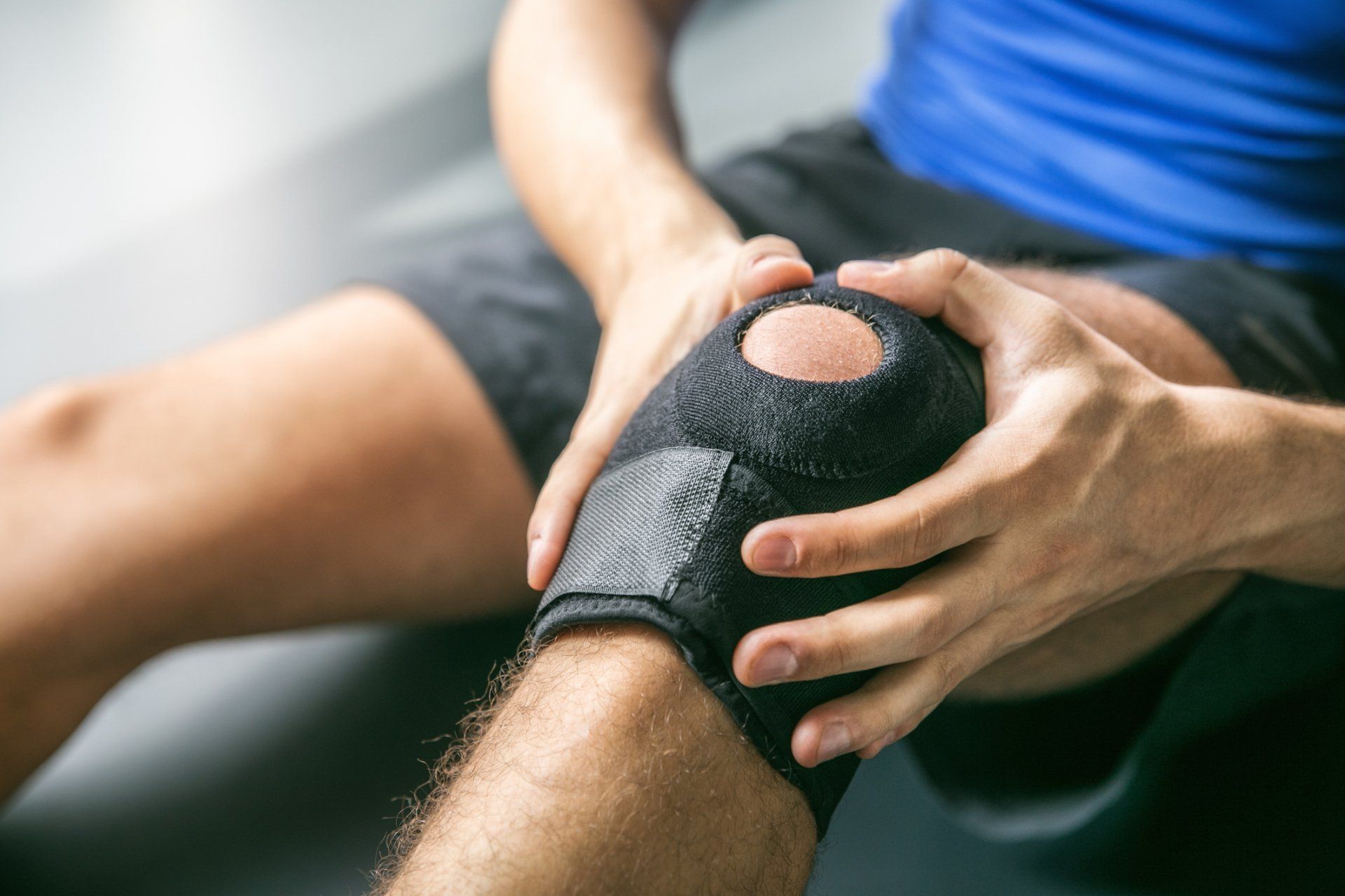 Sports Injuries — Injured Knee with Support in Naples, FL