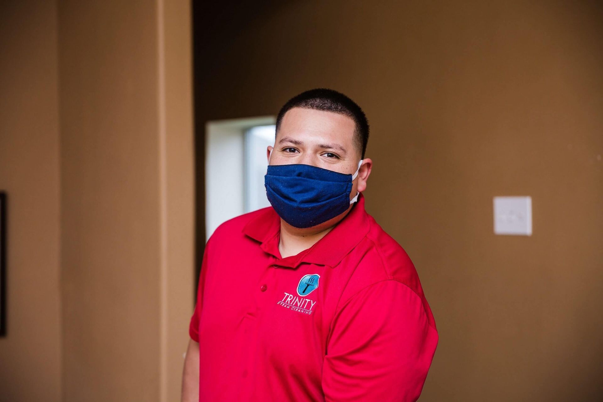 Trinity Steam Cleaning worker wearing a mask.