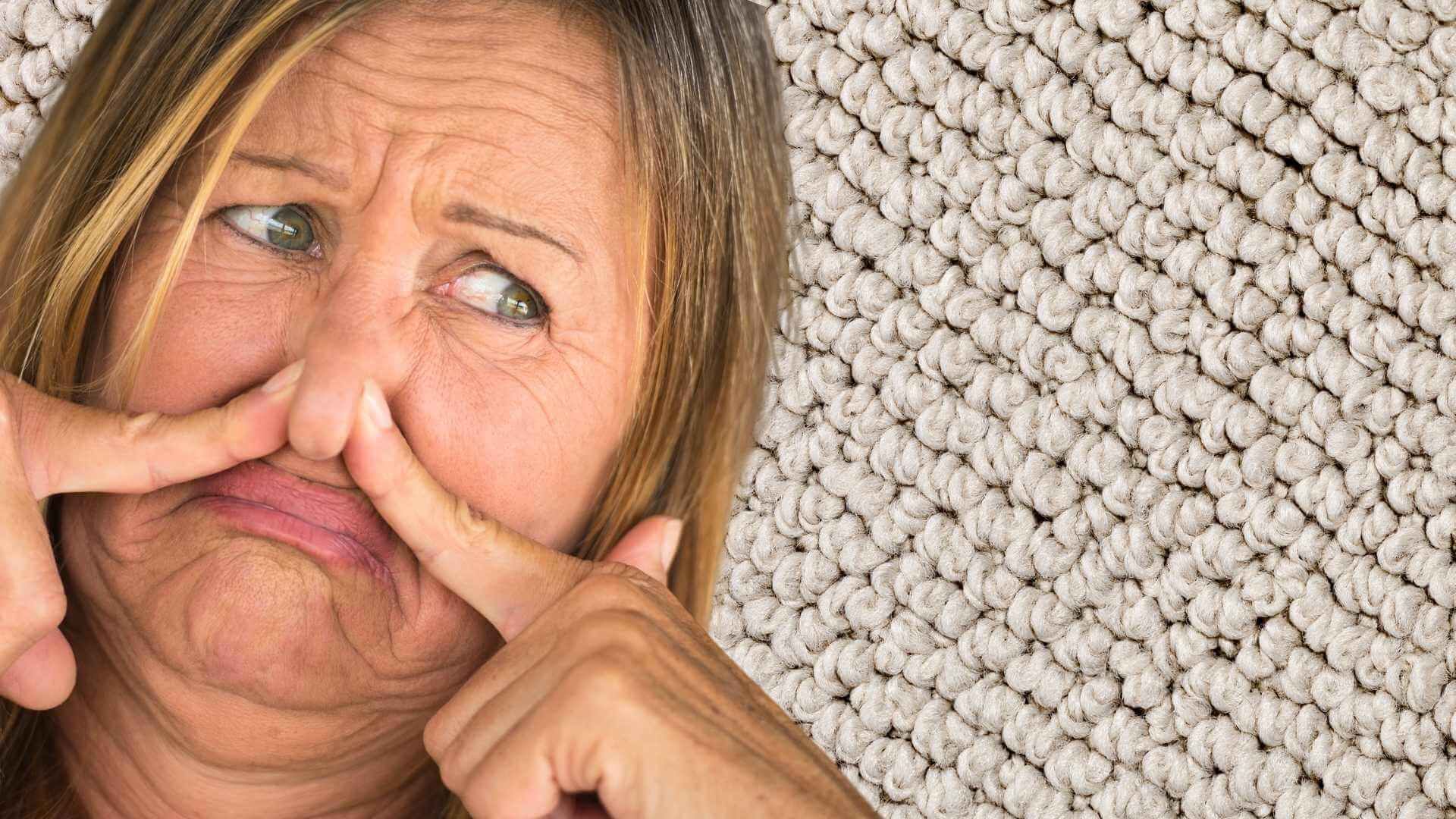 A woman is holding her nose because of a bad smell.